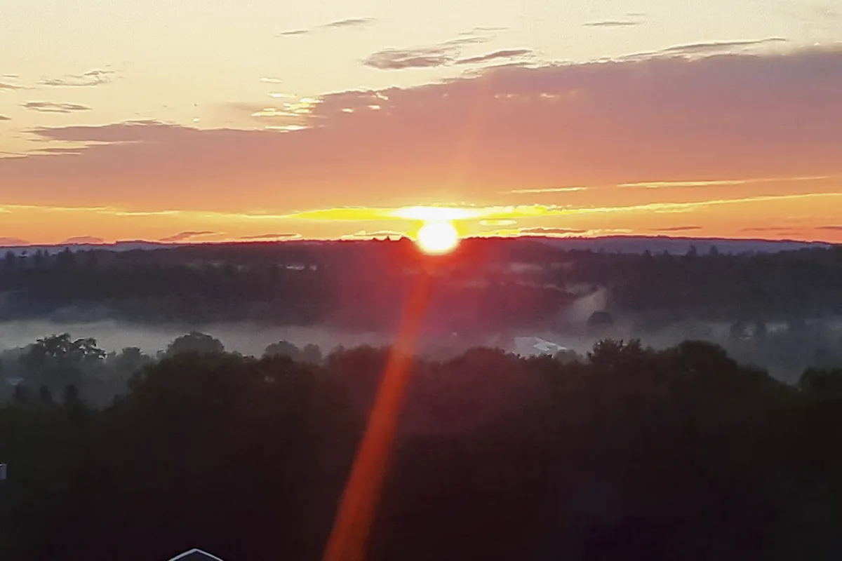 sunrise-lemon-stream-valley-happening-2025 Sunrise over Lemon Stream Valley at Harry Brown’s Farm during The Happening 2025 in Starks, Maine